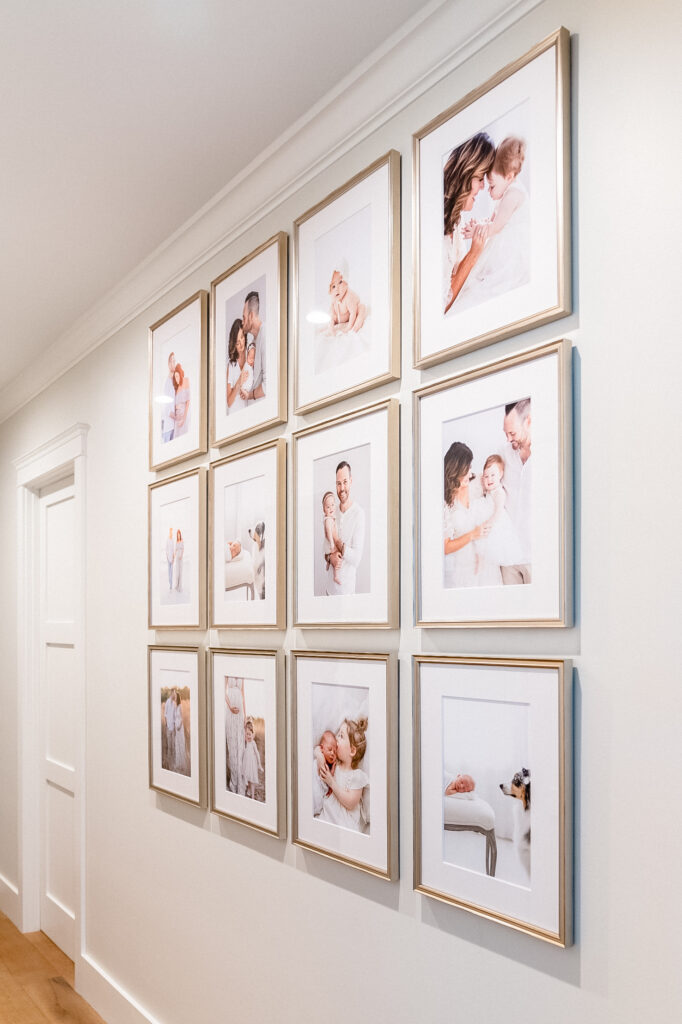 A large wall gallery of 12 frames filled with baby's first year in phoenix Arizona. 
