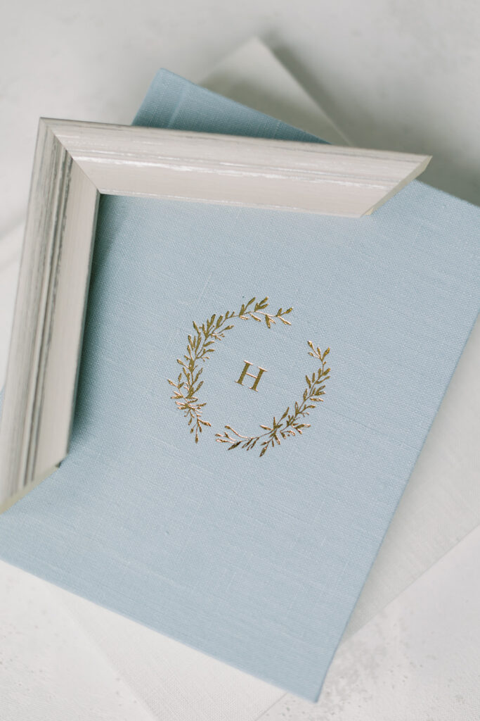 A beautiful blue album with gold debossing and white frame.