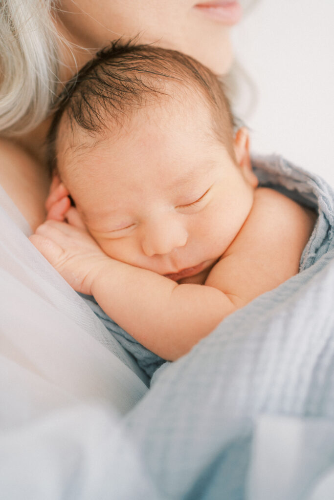 Close up image of mom holding baby boy in Phoenix Arizona